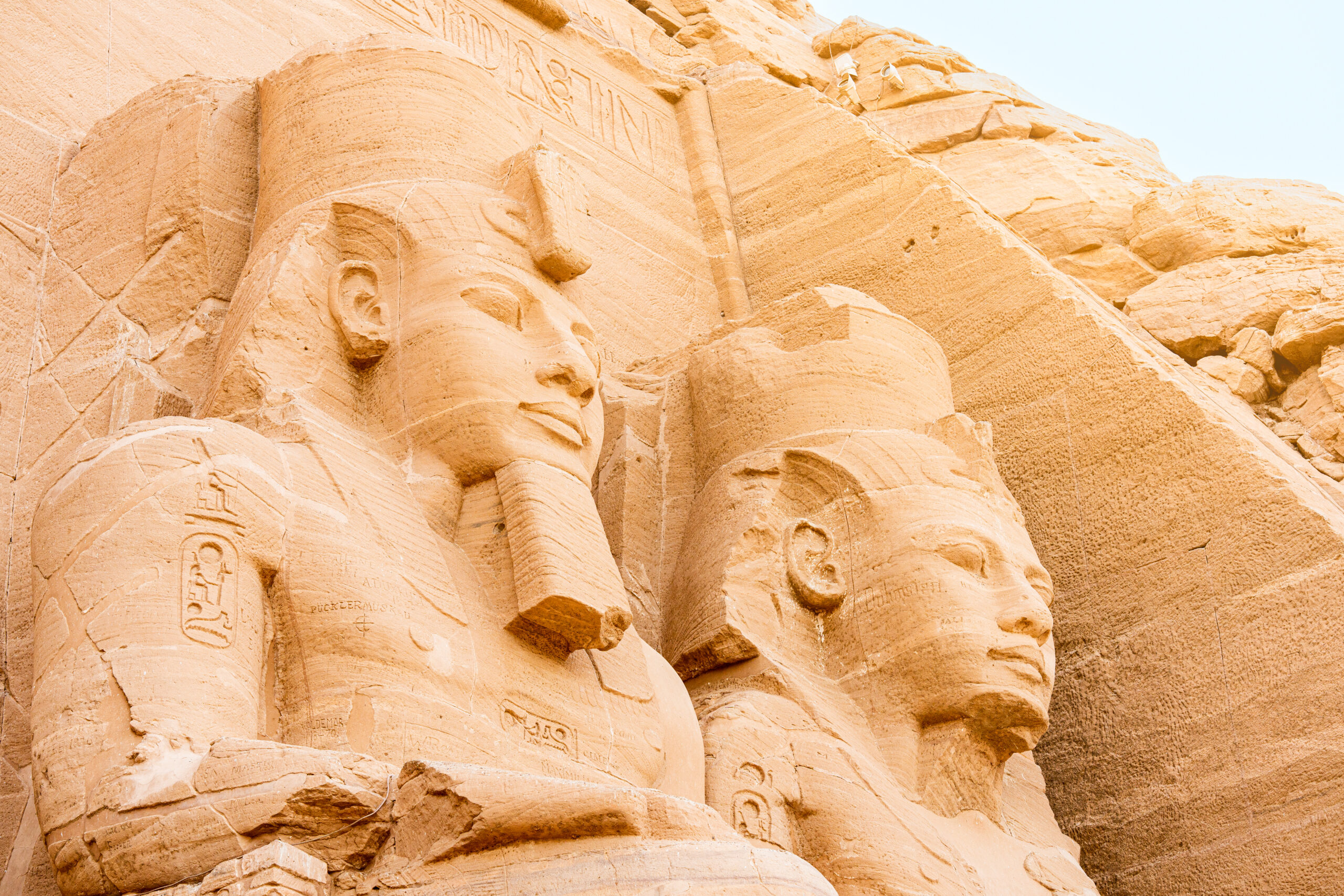 Close up of the faces of two ancient Egyptian statues Alaska